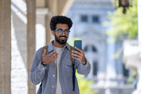 Young man having a video call and looking excited