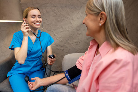 Mature woman controlling blood pressure.の写真素材