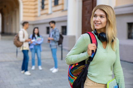 University student girl going on class at the university and looking away.の写真素材