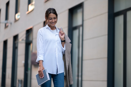 Stylish confident woman in the city street