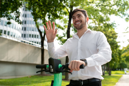 Young man on electric scooter in the city street