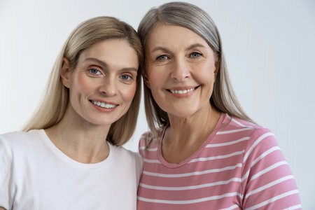 Two smiling pretty ladies looking happy and contented