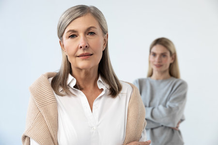 Good-looking mature well-groomed woman with her daughter