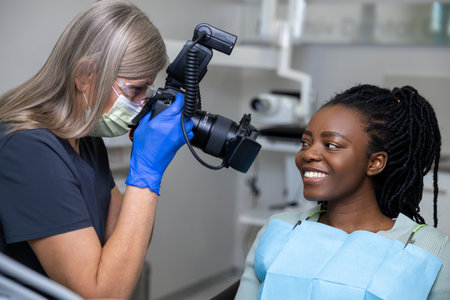 Dentist making teeth photo after oral treatment in clinicの写真素材