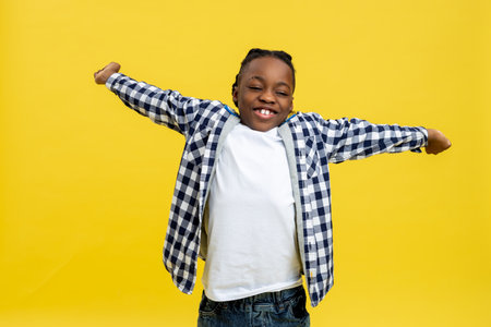 African american boy stretching and looking sleepyの写真素材