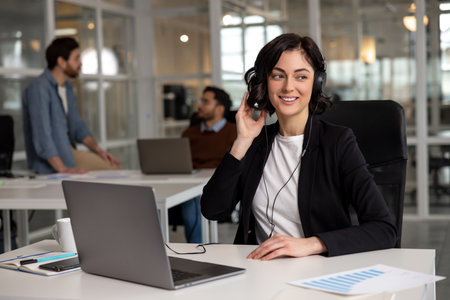 Woman professional in wireless headset talking consulting client