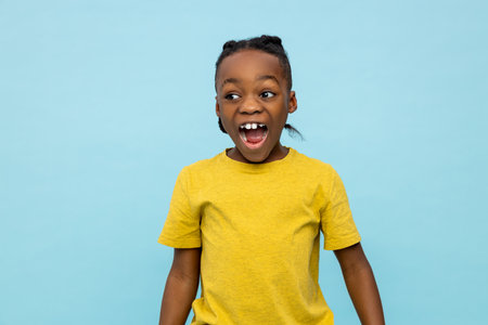 African american cute boy looking excited and contented