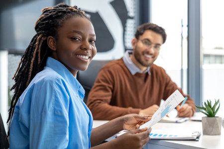 Multiracial coworkers cooperating working at office meetingの写真素材