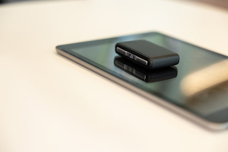 Tablet and car keys laying on the table