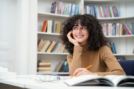 Pretty woman working on the project in the library