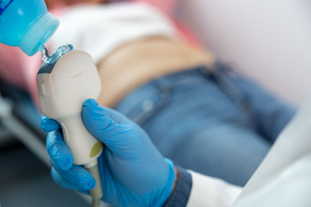Close up picture of a lying female patient and doctors hand with a sensor
