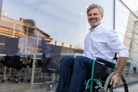 Mature man on a wheelchair looking determined and confidentの写真素材