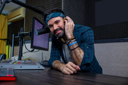 Hipster DJ using recording equipment and digital music creation technologyの写真素材