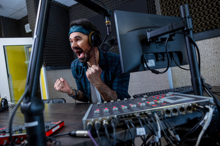 Professional musician with microphone broadcasting online radio live showの写真素材