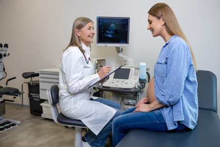 Doctor talking to a pregnant patient after ultrasonography