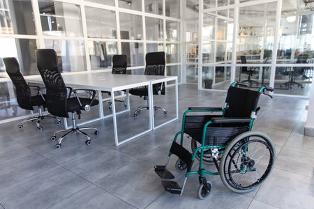 Modern office interior with empty wheelchairの写真素材