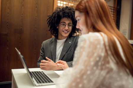 Students working together on the project and looking involvedの写真素材