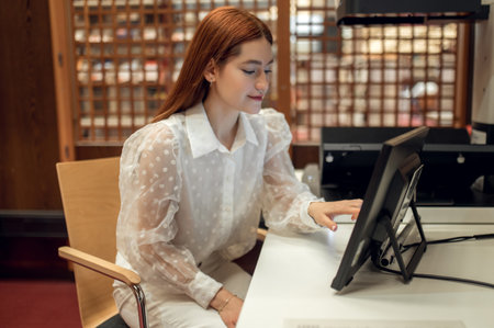 Cute young girl preparing to the class in the library