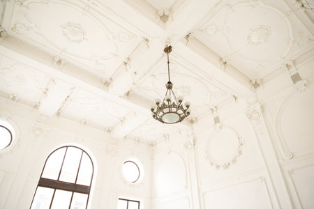 Luxury interior of big room with big windows, white celling and walls