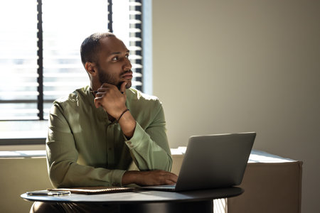 Businessman using laptop computer for working onlineの写真素材