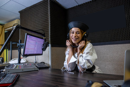 Woman with microphone in radio studioの写真素材