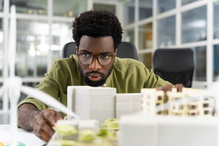 Young african american architect looking concentrated while working on a projectの写真素材