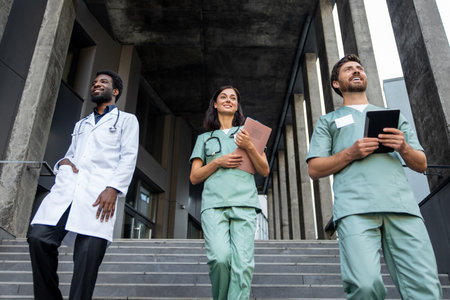 Doctors colleagues going to the rehabilitation center and looking confidentの写真素材