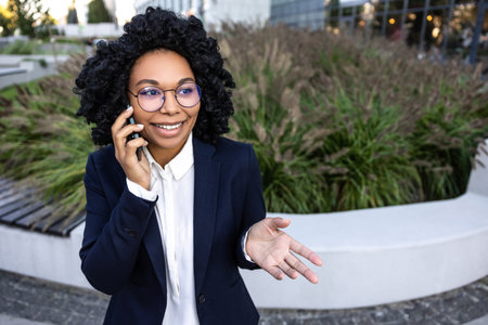 Elegant good-looking business woman talking on the phoneの写真素材