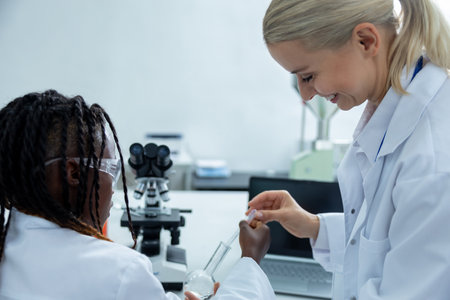 People working in a school laboratory and looking involved