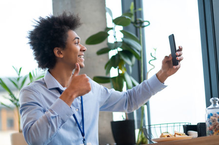 Man looking into phone camera while making selfie