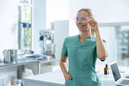 Blonde scientist standing in hospital laboratoryの写真素材