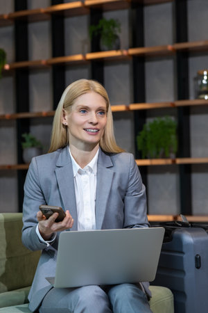Smiling cute blonde woman looking contented and positiveの写真素材