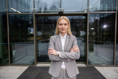 Blonde caucasian business lady in elegant suit looking confident and resolute