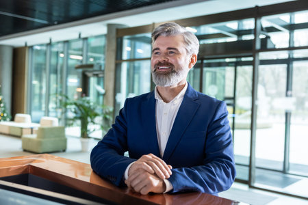 Bearded man entrepreneur standing at business hub reception counter