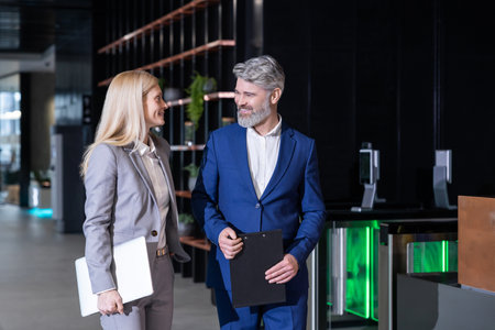 Business colleagues standing together talking about professional growth