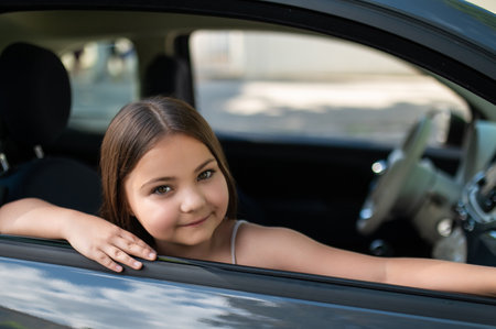 Little kid traveling in vehicle sitting in automobileの写真素材