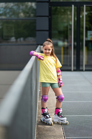 Little girl enjoying roller-skating action outside experiencing funの写真素材
