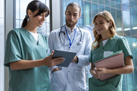Doctors discussing an interesting case and looking involvedの写真素材