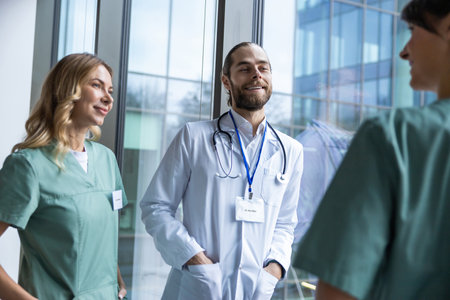 Group of doctors discussing something and looking excited and interestedの写真素材