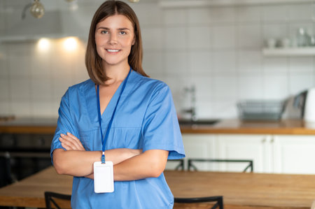 Woman in medical uniform standing in office providing serviceの写真素材