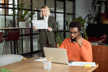 Two business consultants working in the office togetherの写真素材