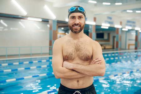 Confident bearded young caucasian man in the swimming poolの写真素材