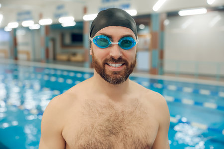 Confident bearded young caucasian man in the swimming poolの写真素材