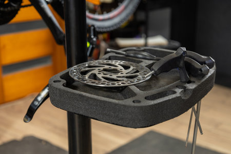 Close-up of bicycle wheel on repair stand in workshopの写真素材