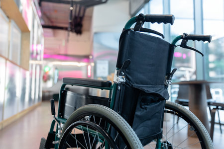 Picture of a wheelchair in the middle of the roomの写真素材