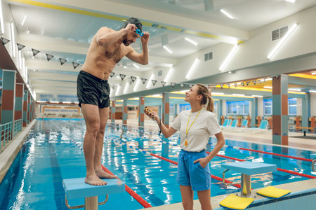 Man having a workout in the swimming poolの写真素材
