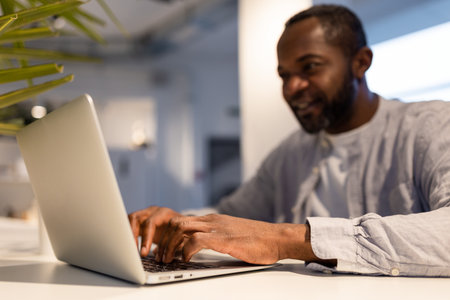 African american man at the laptop in a coworking areaの写真素材