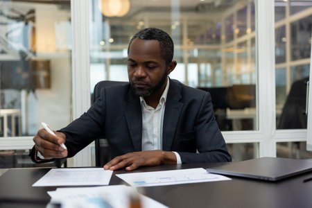 African american business man working in the office and looking confidentの写真素材