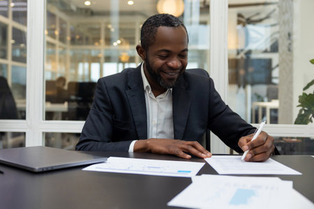 African american business man working in the office and looking confidentの写真素材