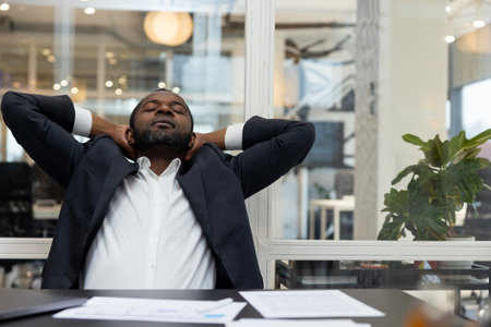 African american businessman feeling relaxed after a long busy working day